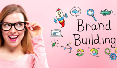 Brand Building with happy young woman holding her glasses