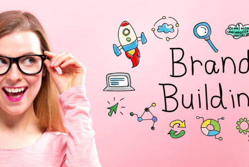 Brand Building with happy young woman holding her glasses