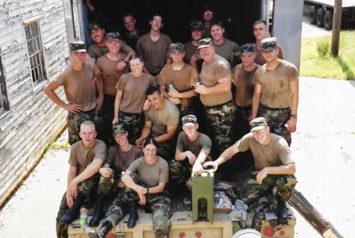 Veterans Day Spotlight – Heather Hooks Heather with her full unit in the back of an army truck