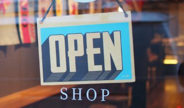 How to Build a Small Business Brand Business with an "Open" sign on the window