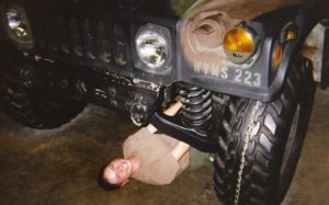 Heather smiling underneath a Hummer